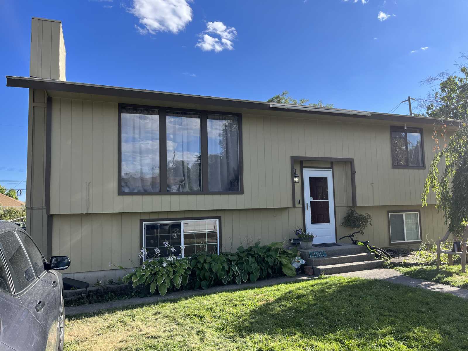After freshly painted grey shed Spokane WA