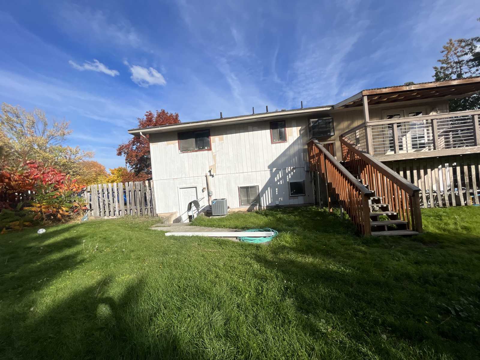 Before old faded exterior siding Spokane home